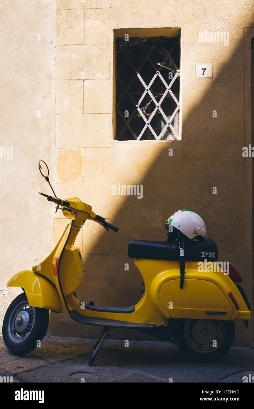 Yellow vespa scooter, Italy Stock Photo