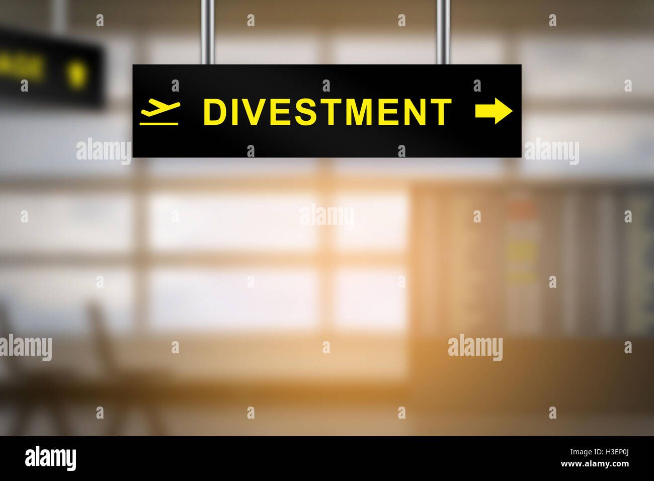 divestment on airport sign board with blurred background and copy space Stock Photo