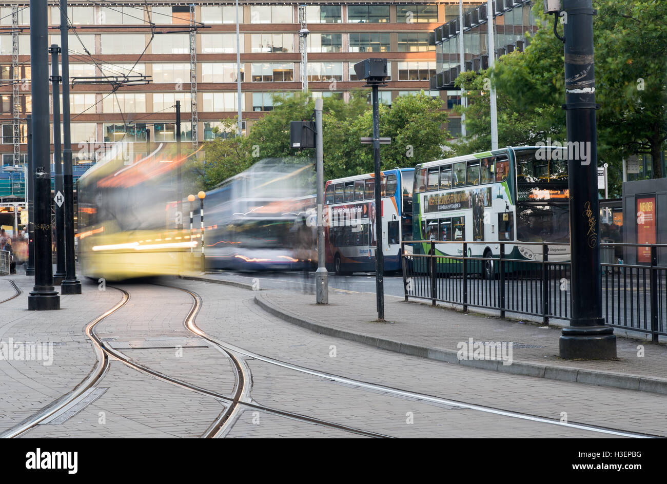 Piccadilly central bus and metro station with moving tram and buses in Piccadilly gardens, Manchester England Stock Photo