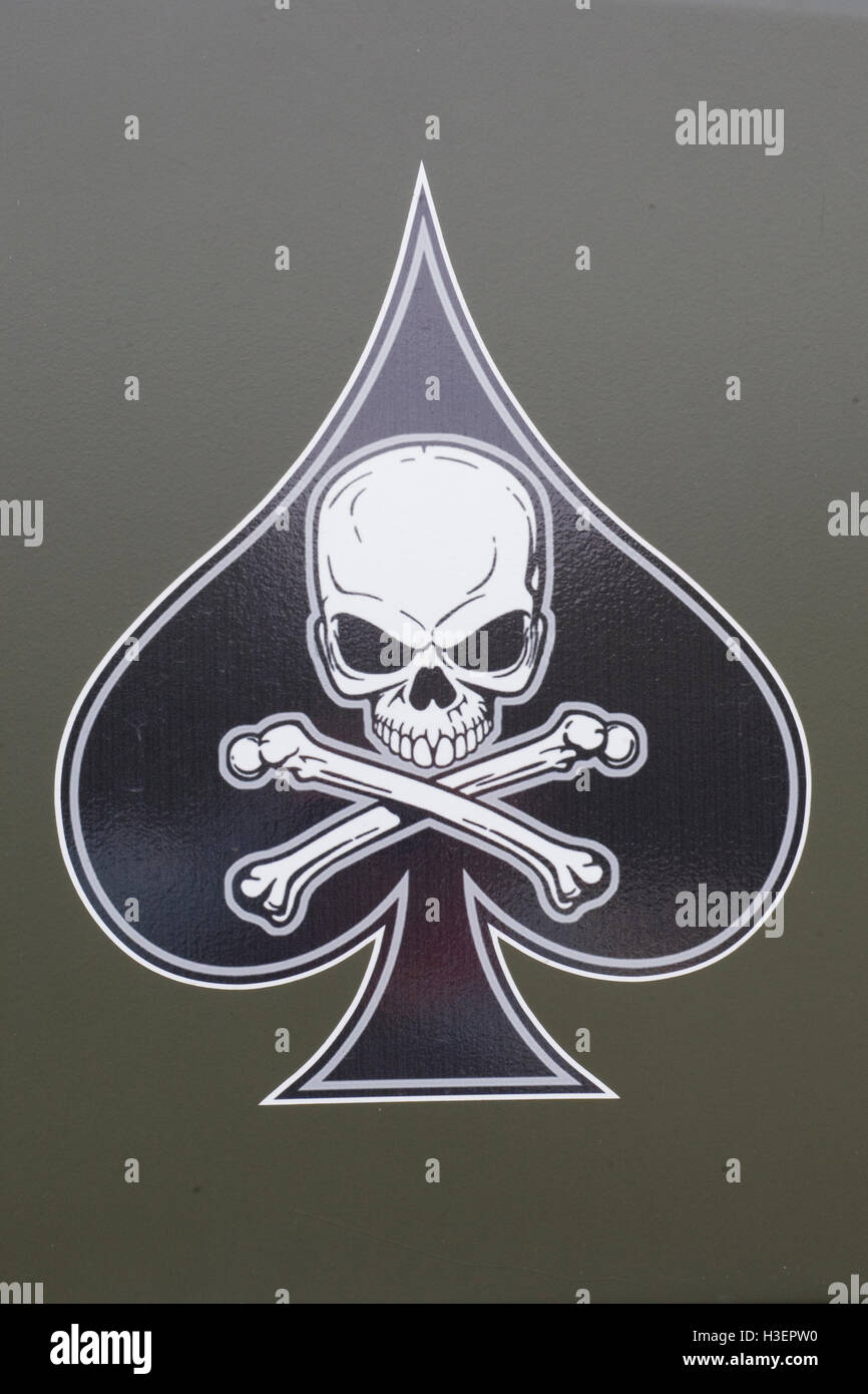 Skull and crossbones in the Ace of Spades on the side of a military Jeep Stock Photo