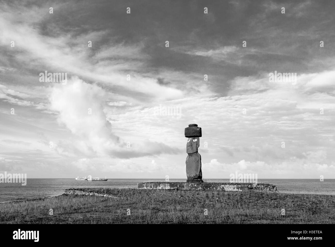 Black and white photo of a moai statue at Ahu Tahai on Easter Island in Chile Stock Photo