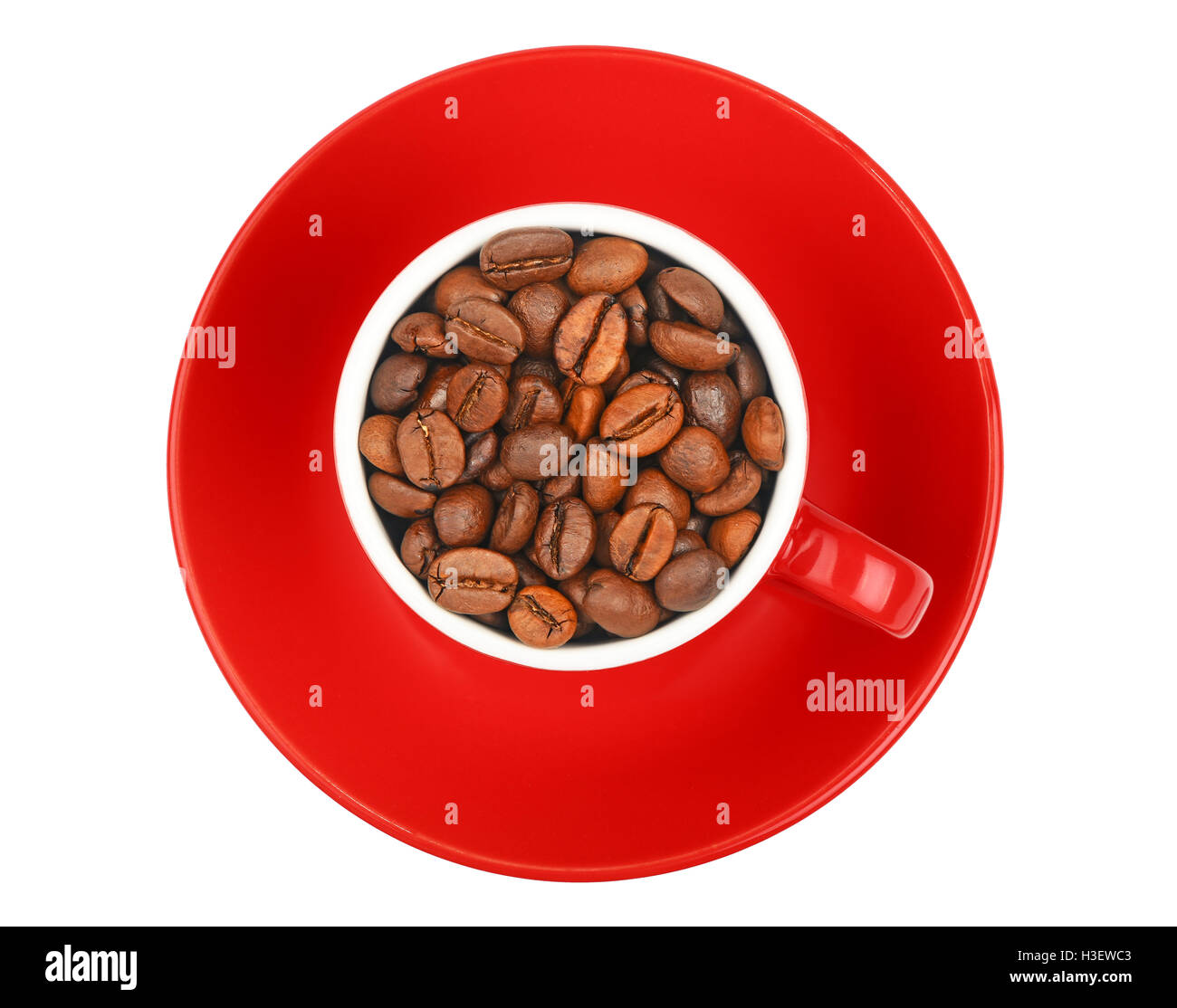 One small red espresso cup full of roasted coffee beans, with saucer isolated on white background, top view, bird eye view Stock Photo