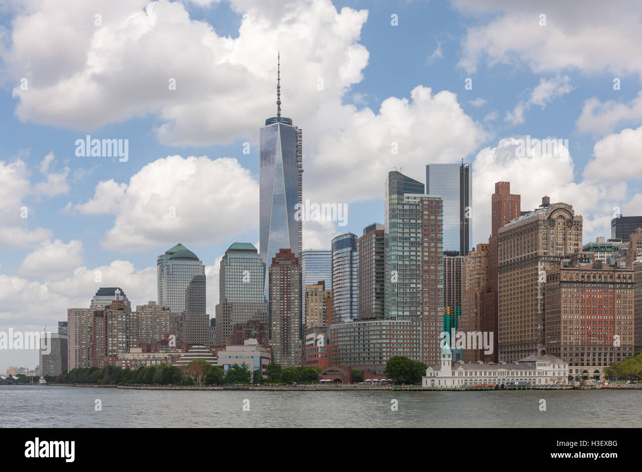 A view of lower Manhattan skyline and One World Trade Center in from New York Harbor in New York City. Stock Photo