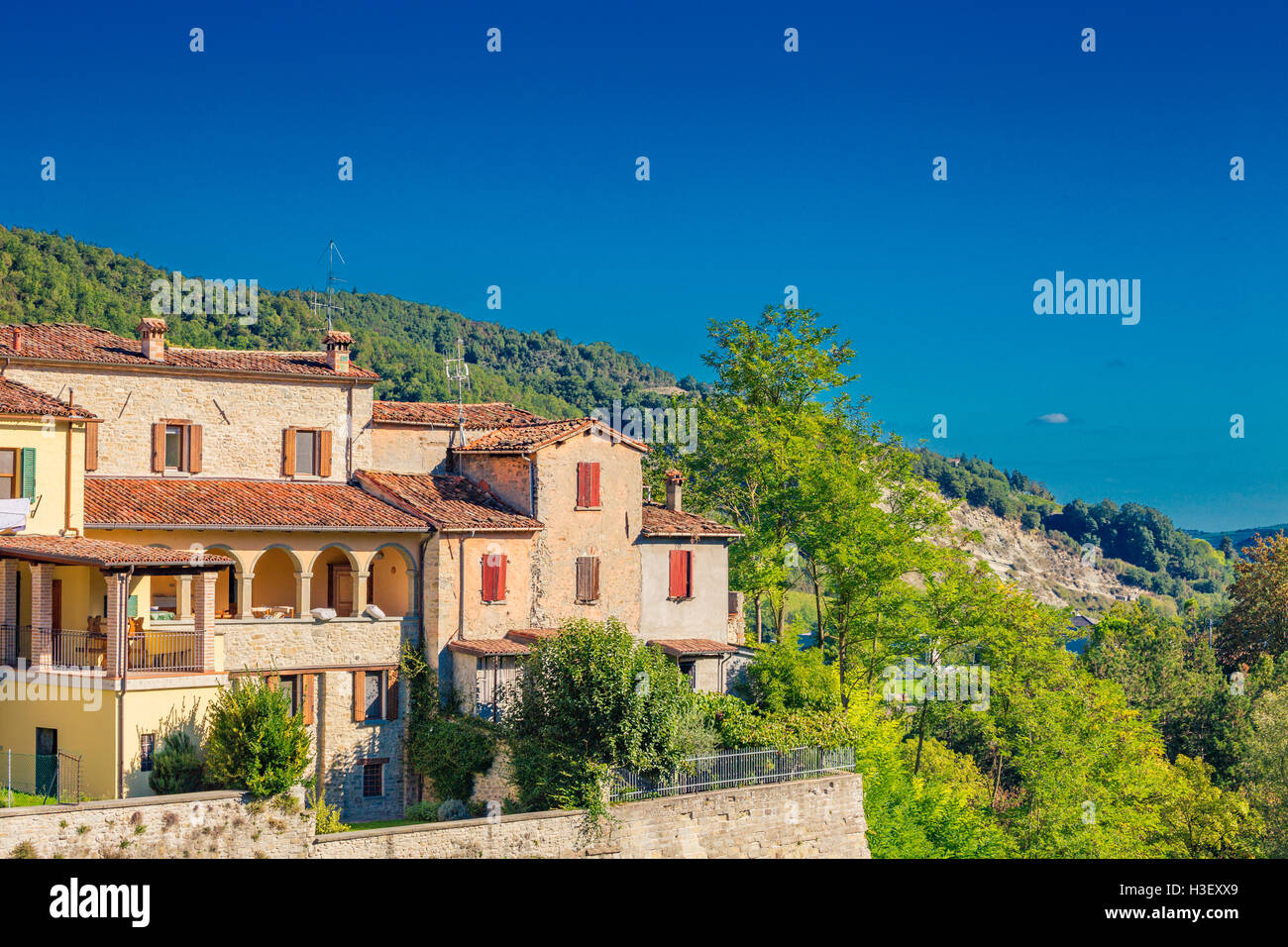 perched houses on ancient fortified ramparts of a medieval village on
