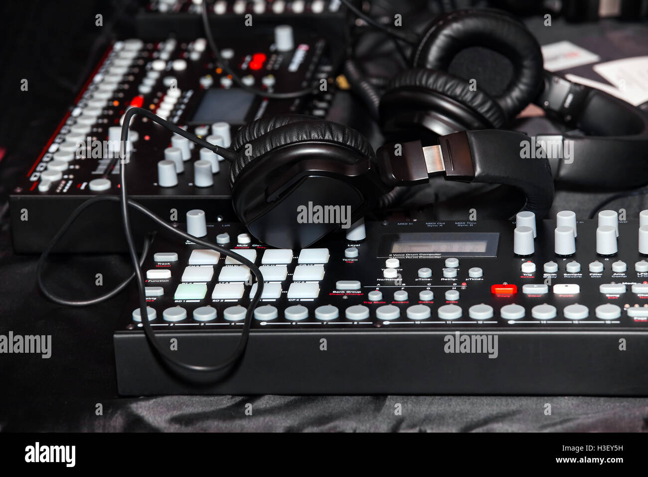 Black headphones on the keyboard piano Stock Photo Alamy