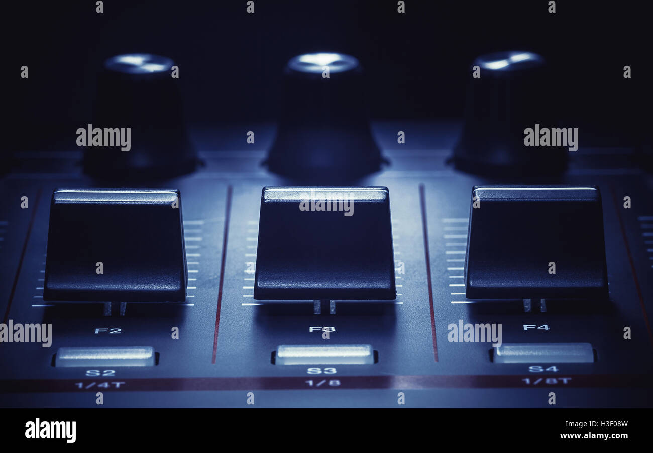 Details of a modern midi controller, view on sliders and knobs Stock