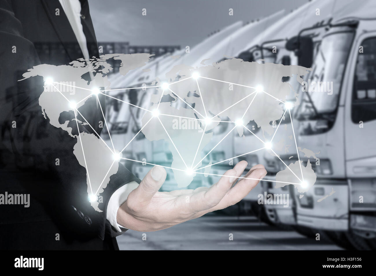 Global logistics network map on hand of businessman, container cargo