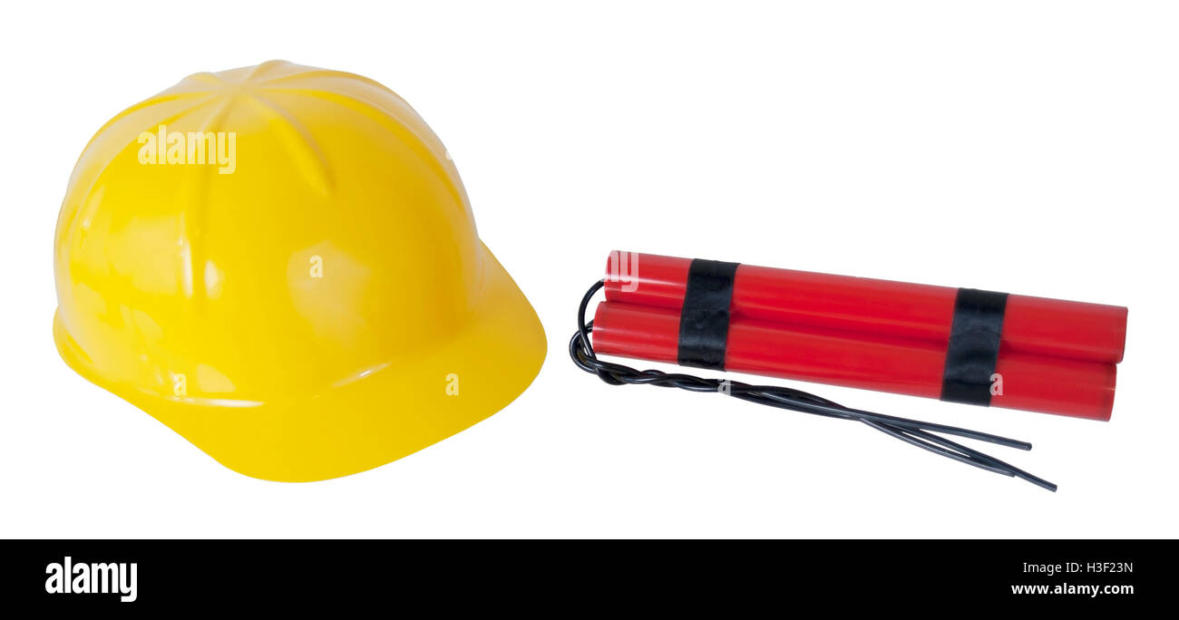 Yellow hard hat worn for protection and dynamite - path included Stock Photo