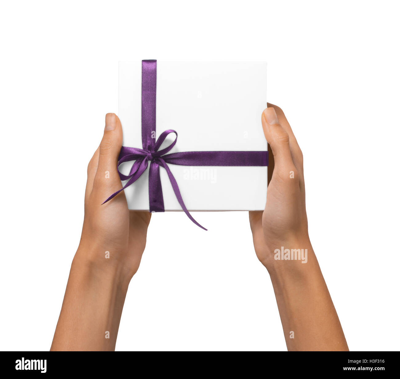 Isolated Woman Hands holding Holiday Present White Box with Ribbon on a White Background. Giving hand proposing and opening the present box. Stock Photo