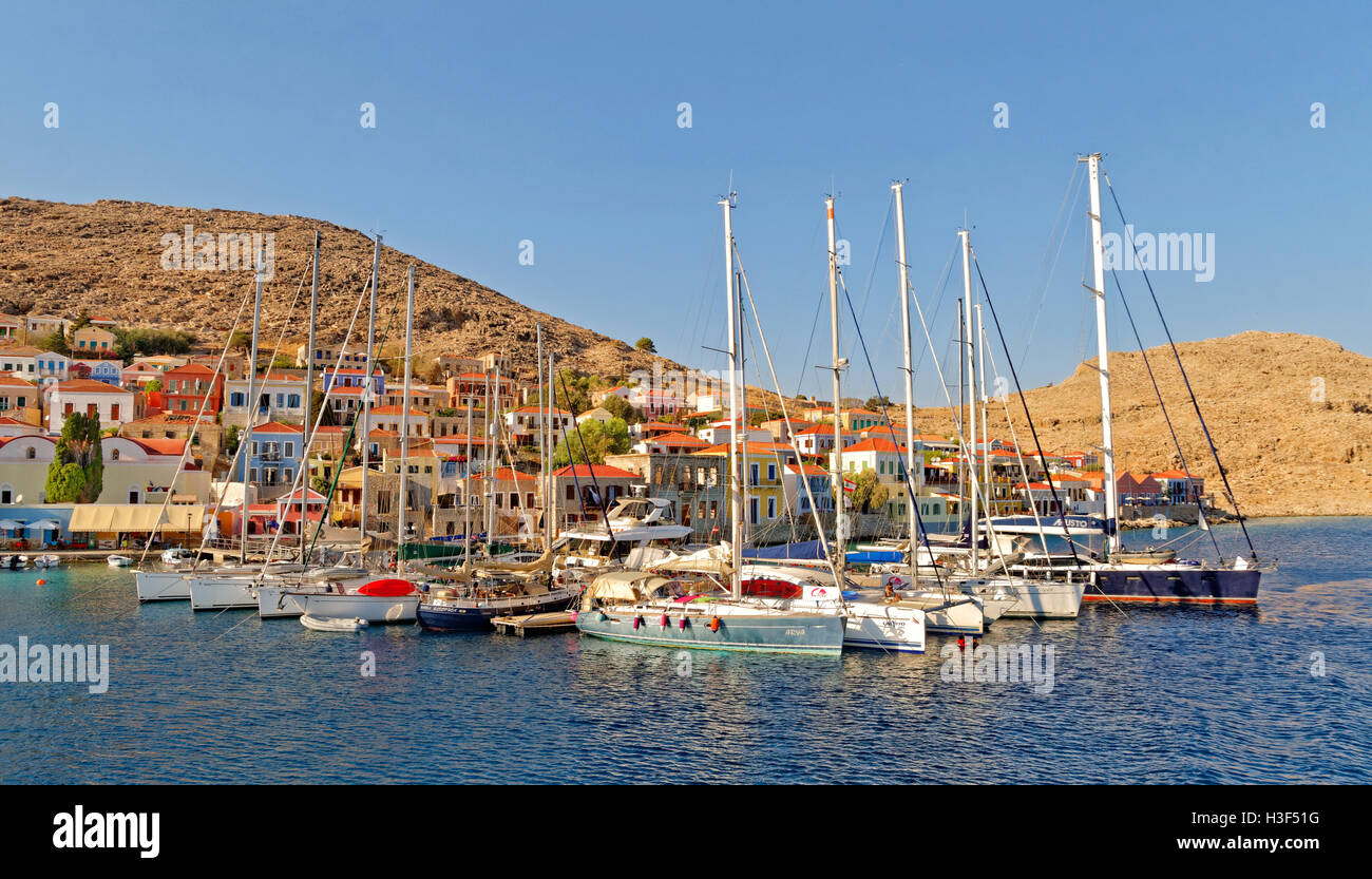 Yacht berths at Chalki town, Greek island of Chalki situated off the north coast of Rhodes, Dodecanese Island group, Greece. Stock Photo