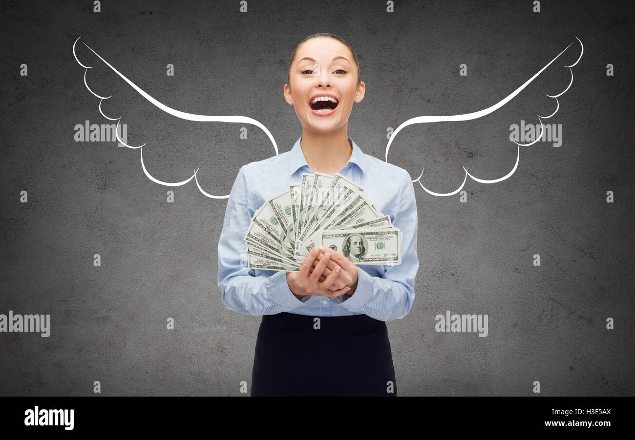 businesswoman with dollar money and angel wings Stock Photo - Alamy
