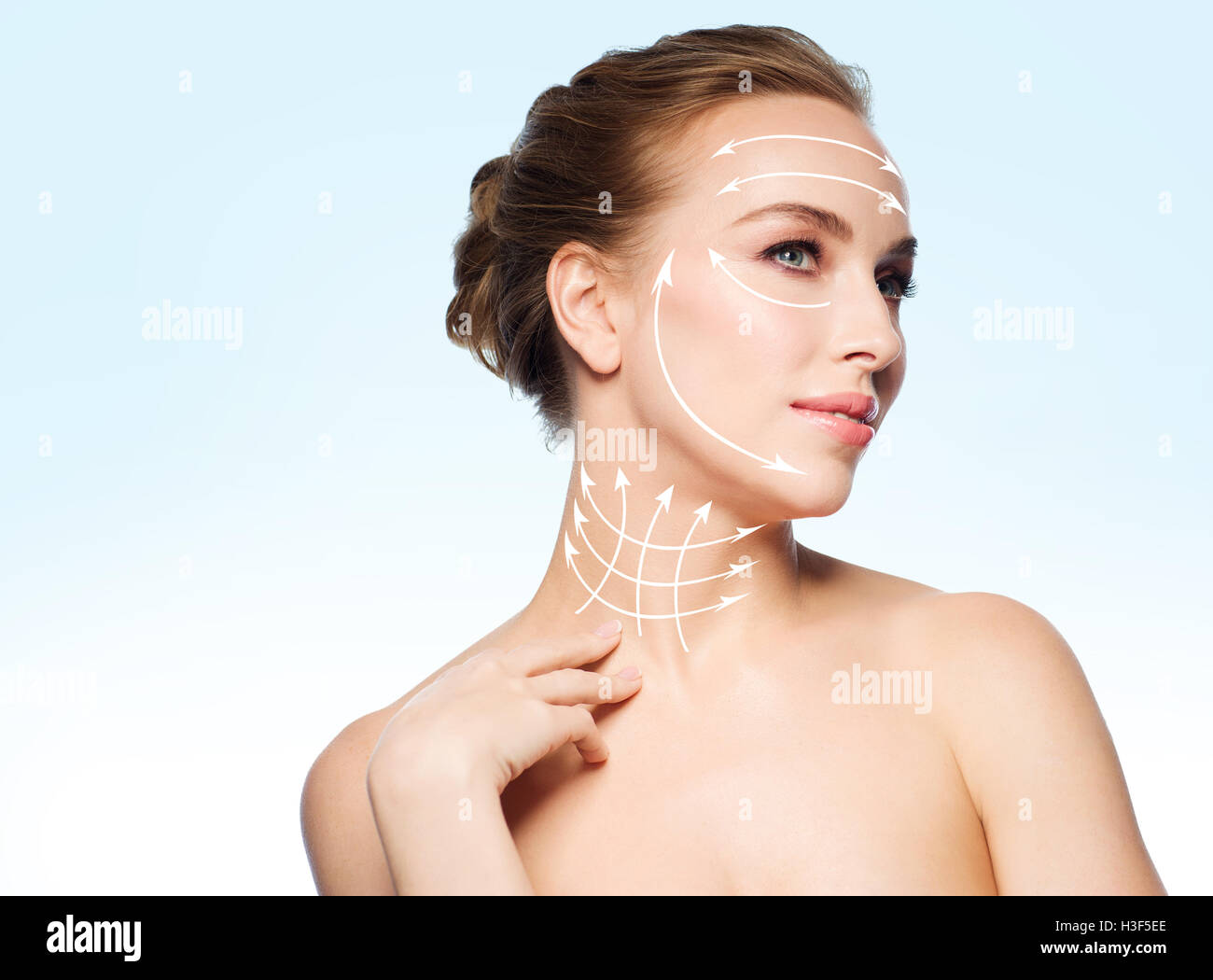 beautiful young woman touching her neck Stock Photo - Alamy
