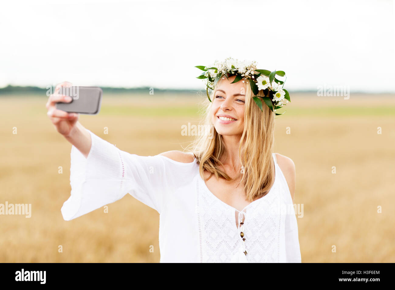 happy young woman taking selfie by smartphone Stock Photo - Alamy