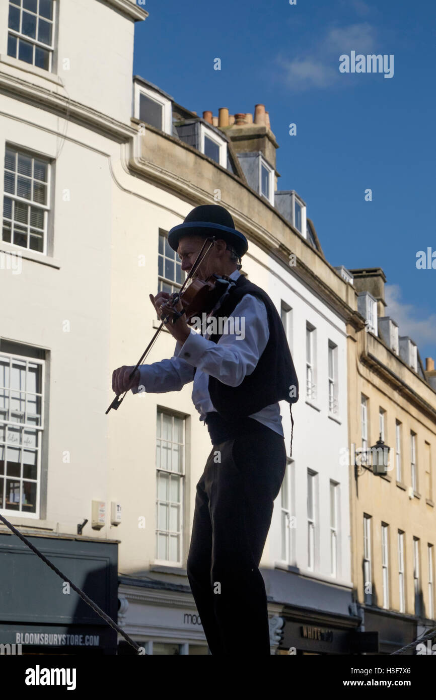 Street entertainers or Buskers in the city of Bath Somerset England UK Lindsay Kwabana Fiddler on a rope Stock Photo