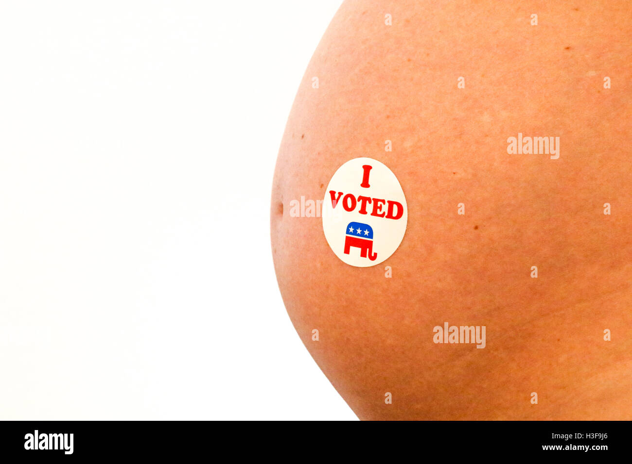Voting sticker on a pregnant woman Stock Photo