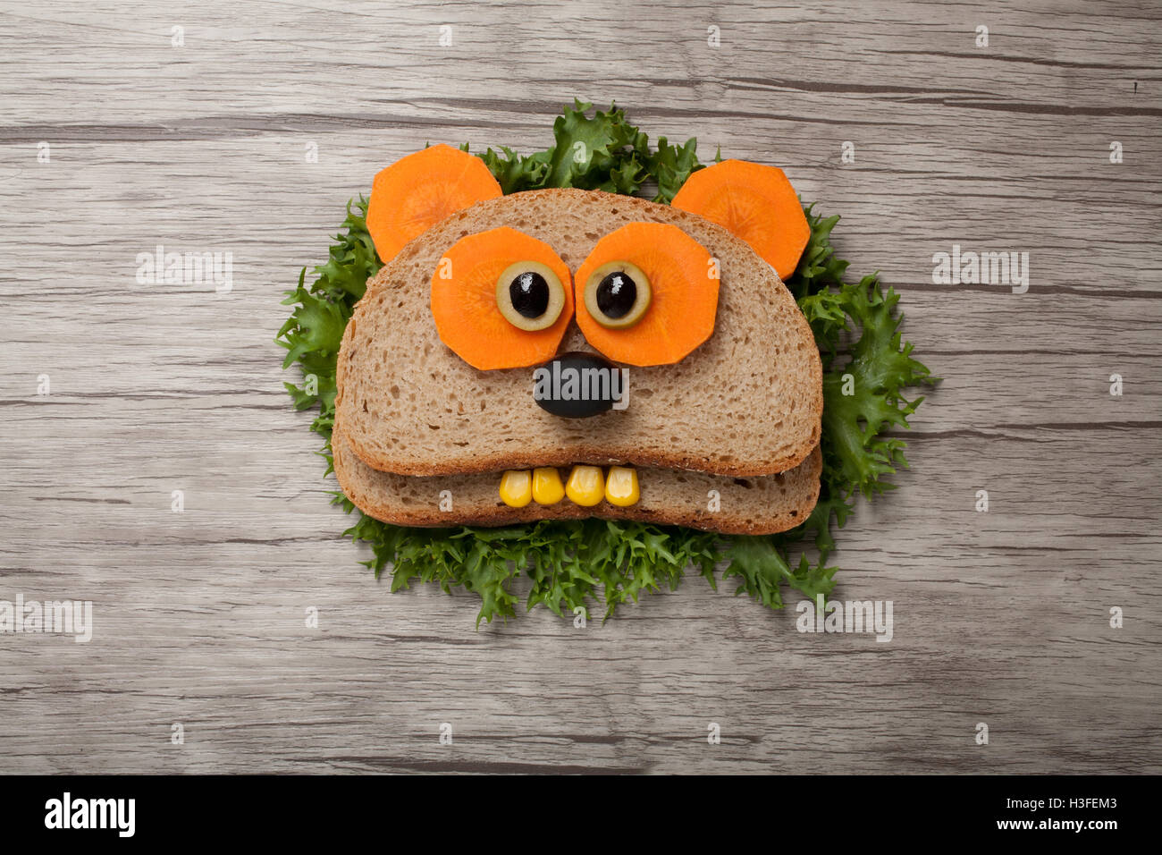 Surprised panda made of bread on board Stock Photo
