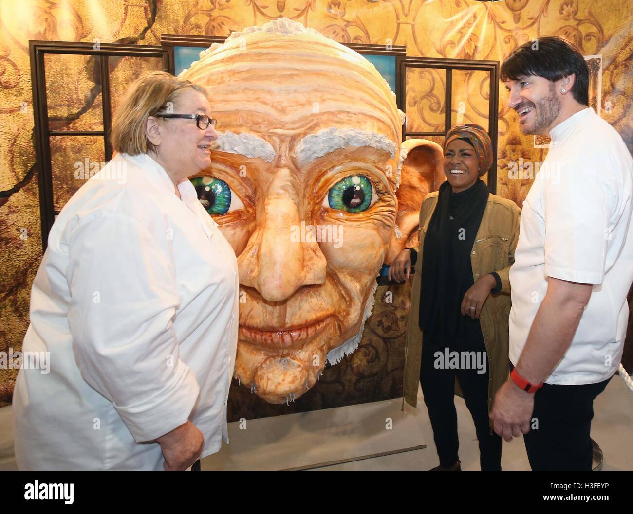 (Left to right) TV chef Rosemary Shrager, Great British Bake Off winner and master patissier Eric Lanlard look at a sugar sculpture at the Cake and Bake Show at ExCeL in London. Stock Photo