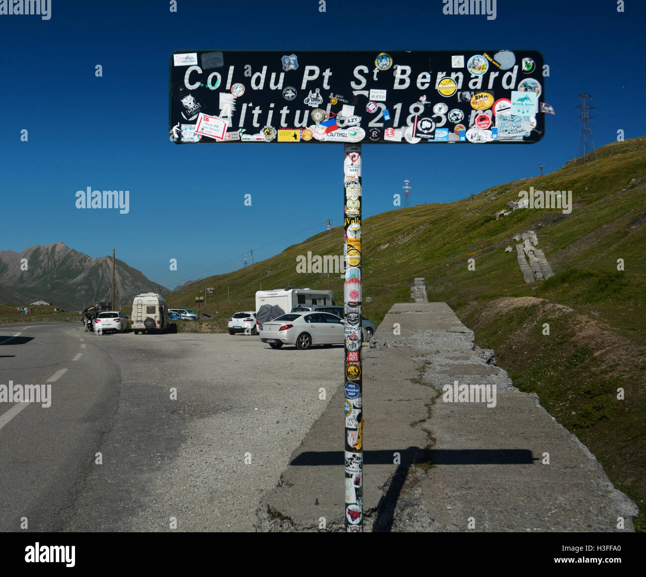 France, Italy, Col du Petit Saint Bernard pass (Little St Bernard, Piccolo San Bernardo ), summit sign with stickers Stock Photo