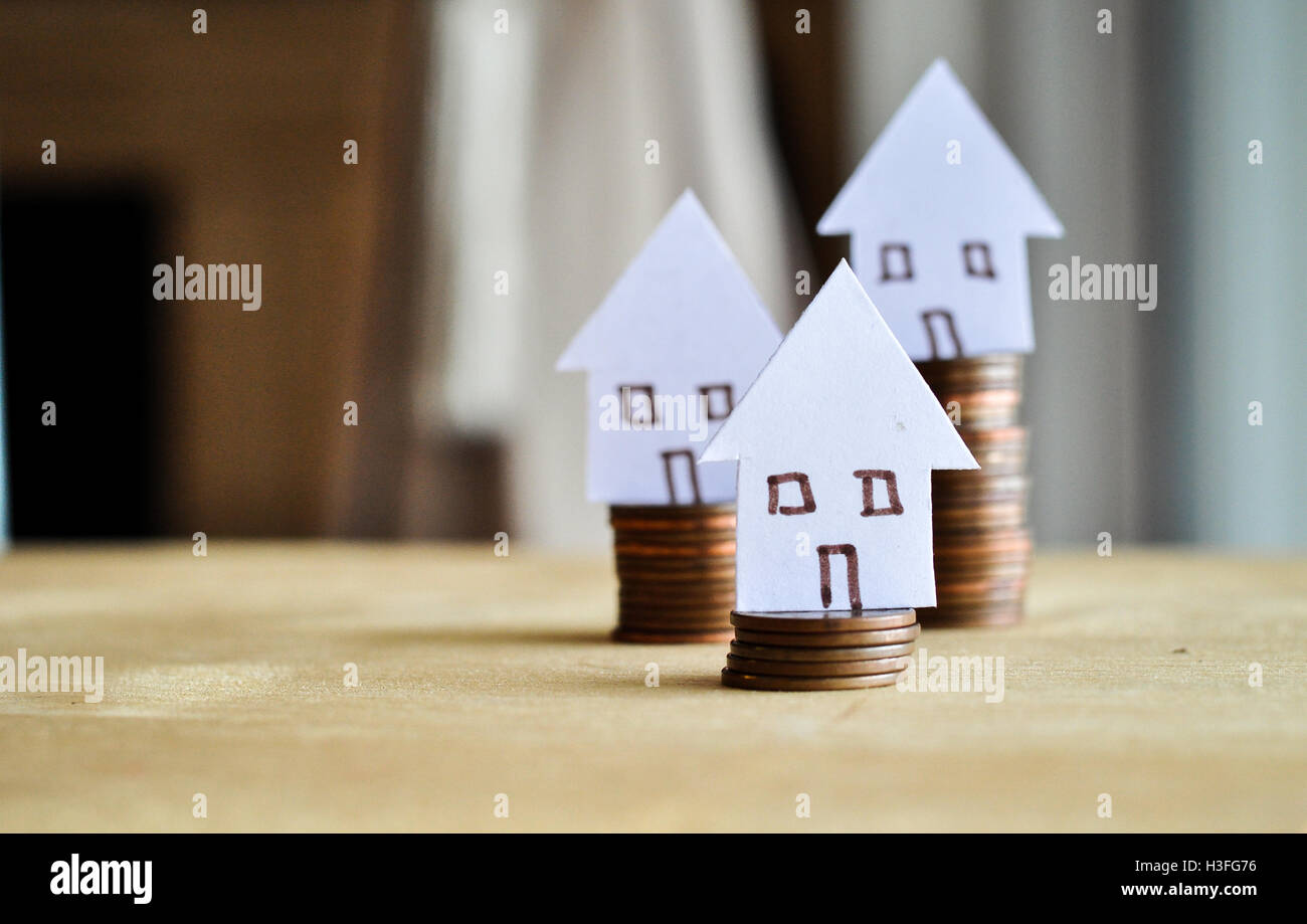 Mortgage concept by money house from the coins Stock Photo