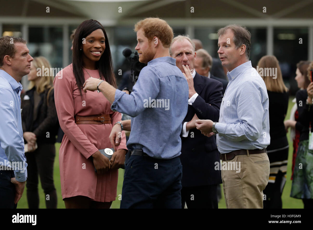 Prince Harry speaks to England netball player Eboni Beckford-Chambers at Lord's Cricket Club in London as he learns about the Coach Core sports coaching apprenticeship scheme which woks with young people who have limited opportunities, and trains them to be sports coaches, positive role models and community mentors. Stock Photo