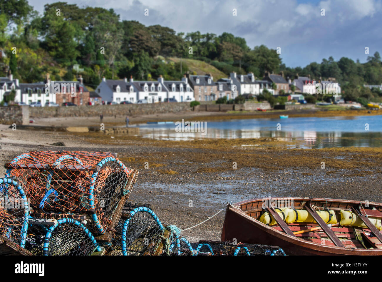 Stacked lobster creels / traps on quay in the Plockton Harbour, Scottish Highlands, Scotland, UK Stock Photo