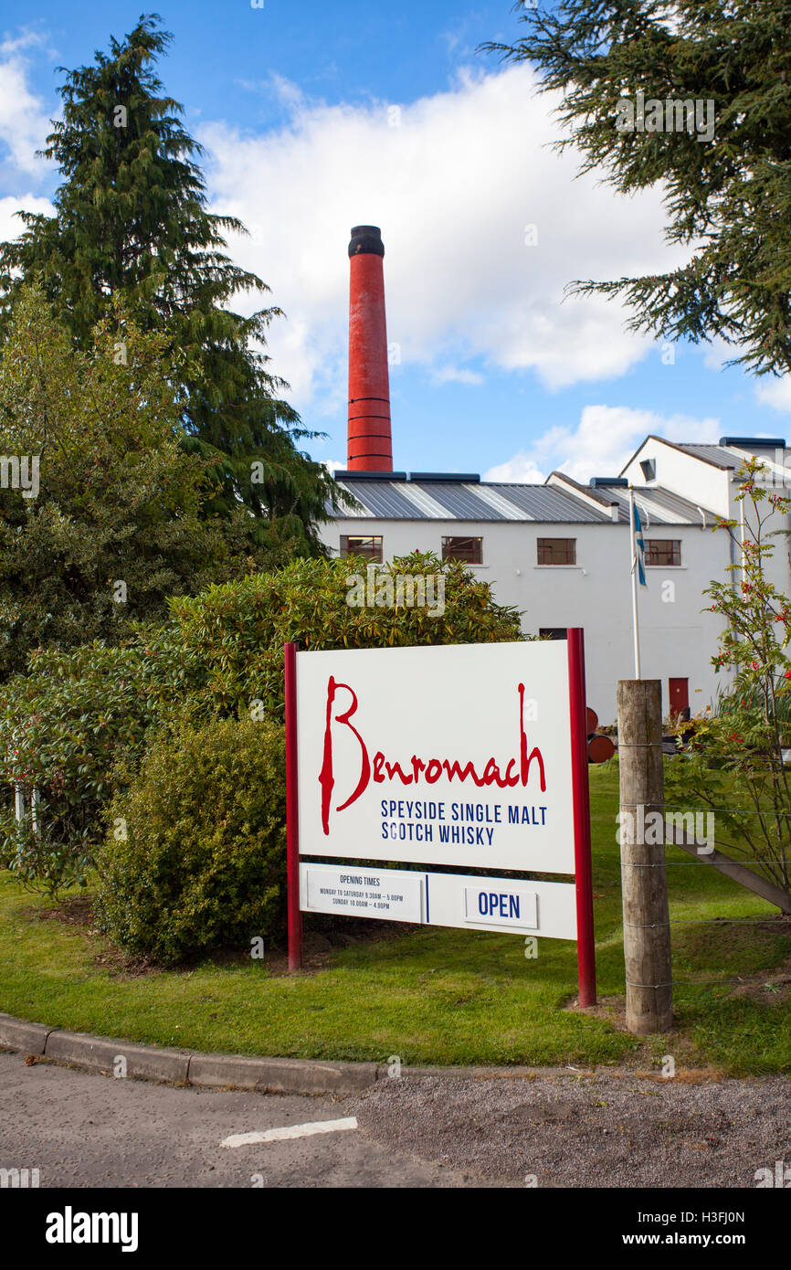 White distillery buildings at the  Benromach Distillery, Speyside, Highlands, Scotland with the brand name visible on the exterior of the building Stock Photo