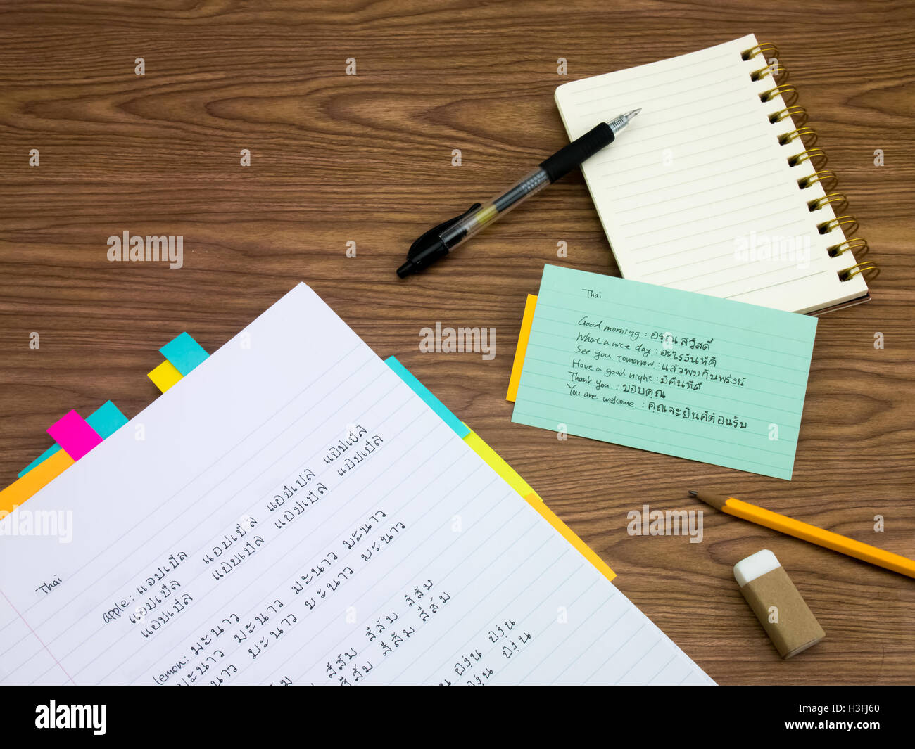 Thai; Learning New Language Writing Words on the Notebook Stock Photo