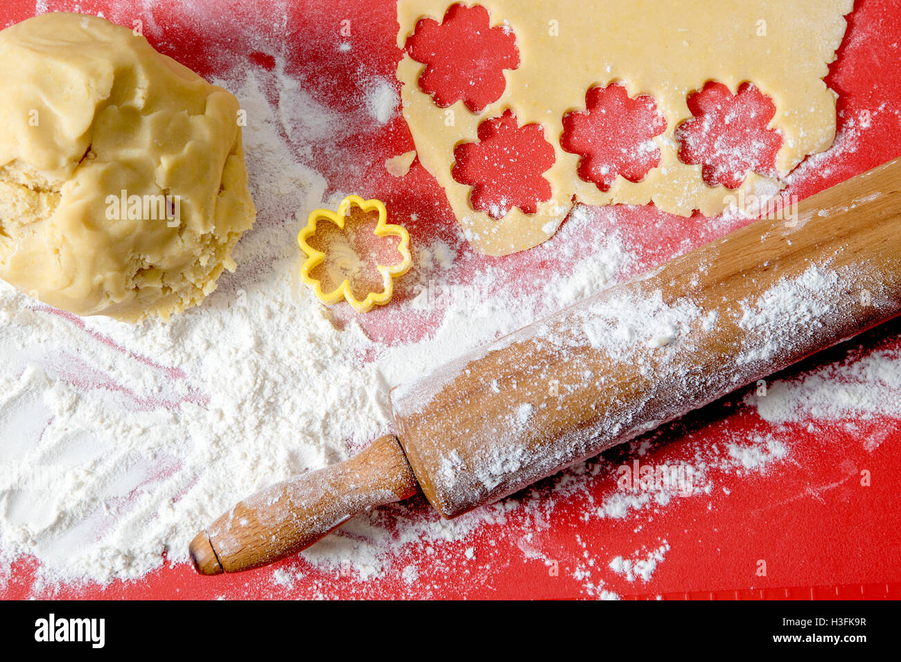 Wooden Rolling pin and pastry cutter ready to make Christmas cakes and