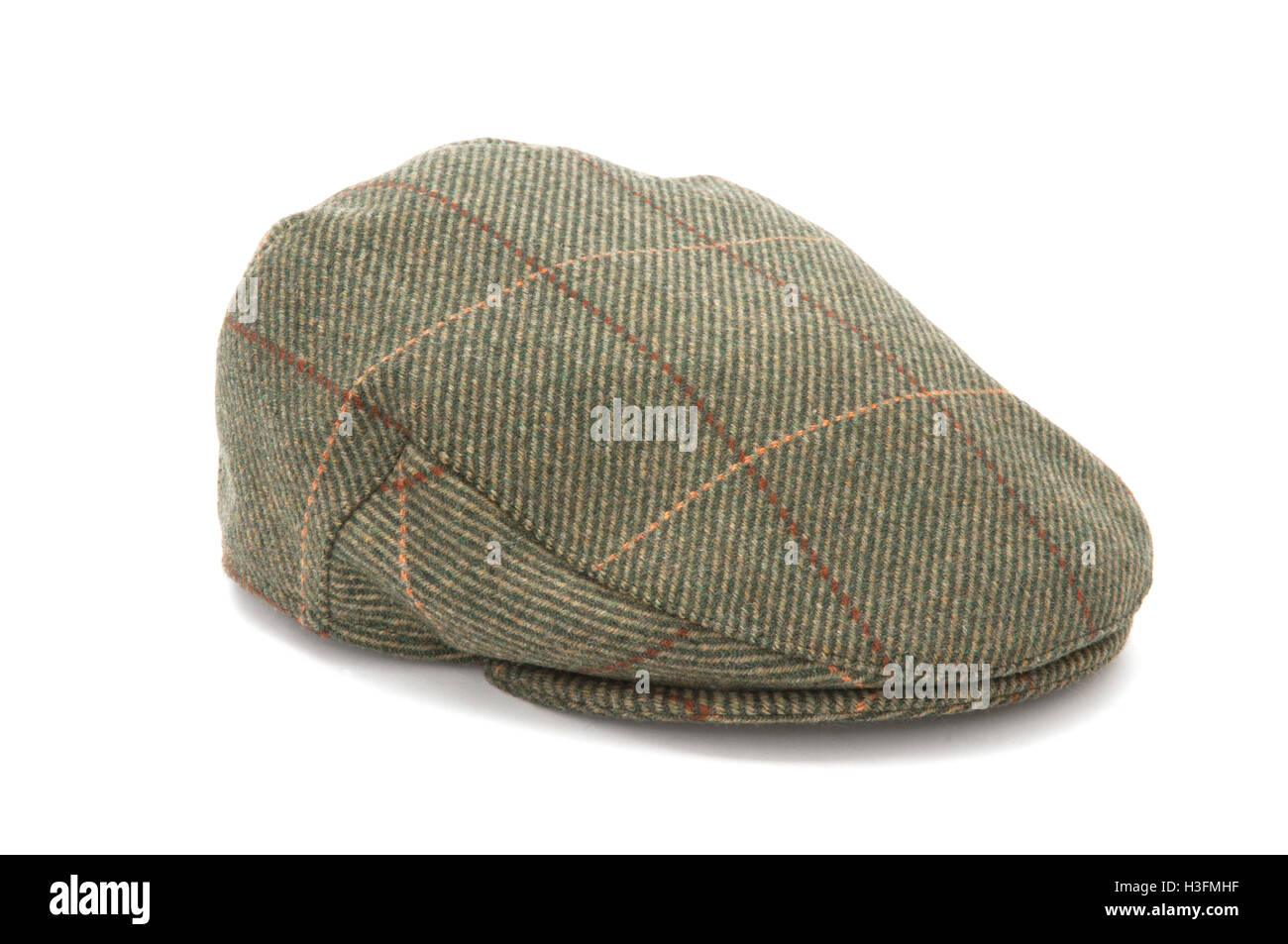 Cutout of a green tweed hunting hat or flat cap Stock Photo - Alamy