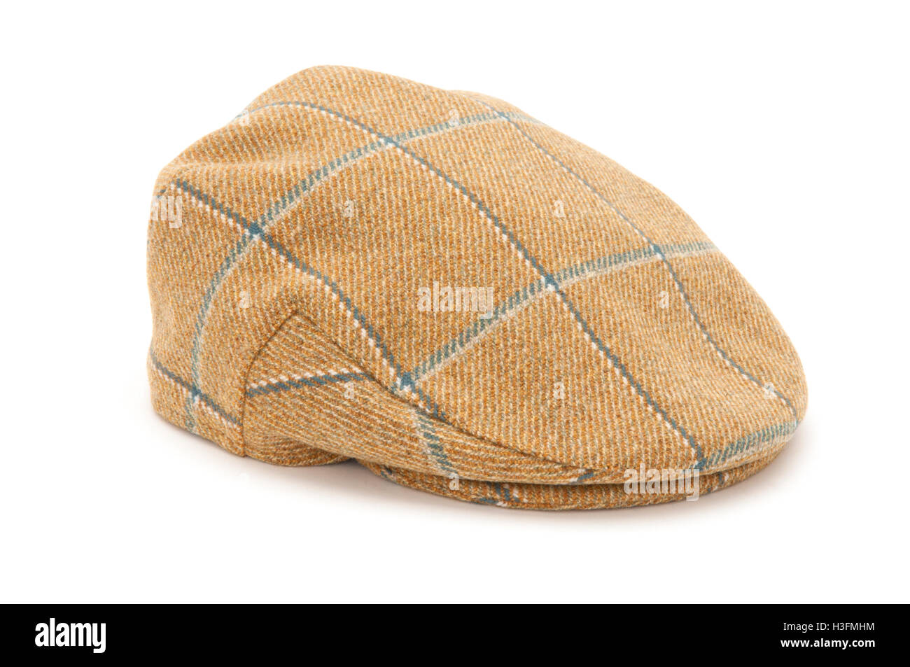 Cutout of a checked tweed hunting hat or flat cap. Stock Photo