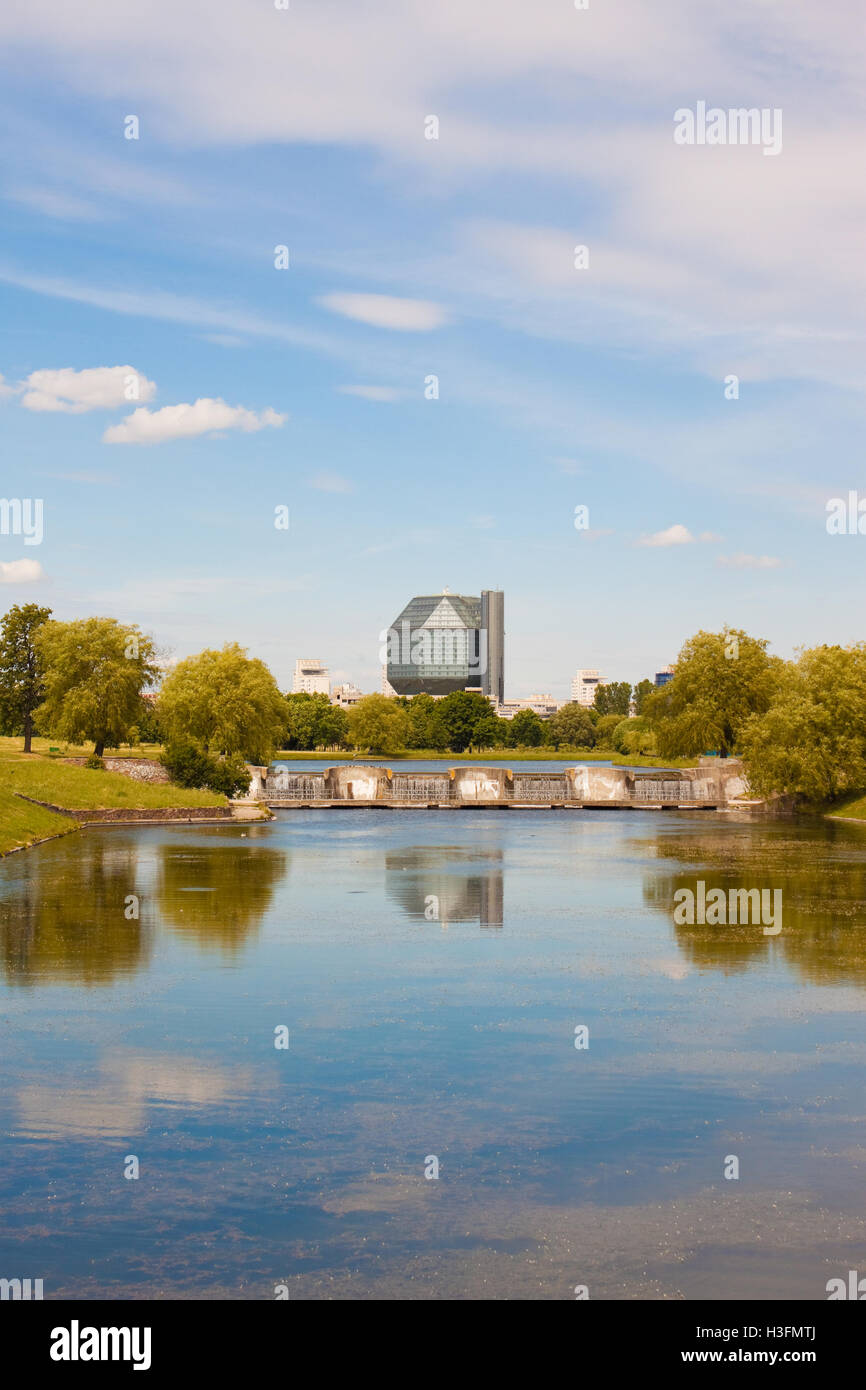 Minsk, Belarus - June 18, 2015: Modern building of National library of Belarus, view from the beautiful park on the river. Stock Photo