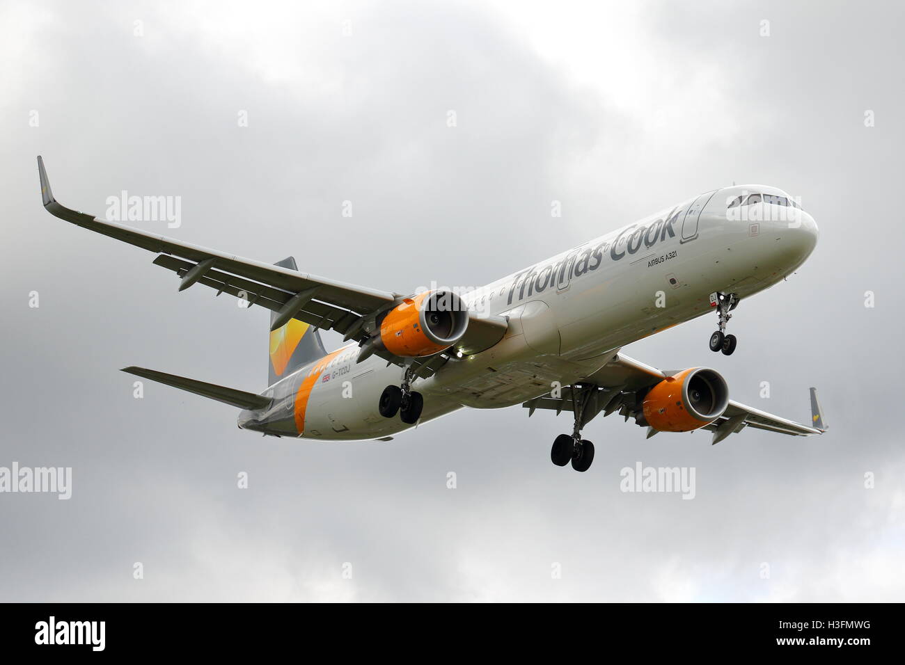 Thomas Cook Airbus A321-200 G-TCDJ landing at Birmingham Airport, UK Stock Photo