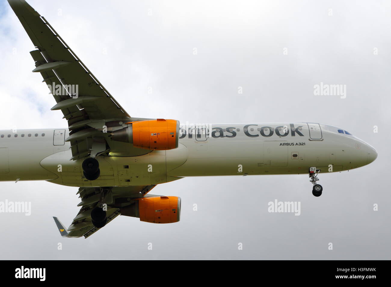 Thomas Cook Airbus A321-200 G-TCDJ landing at Birmingham Airport, UK Stock Photo