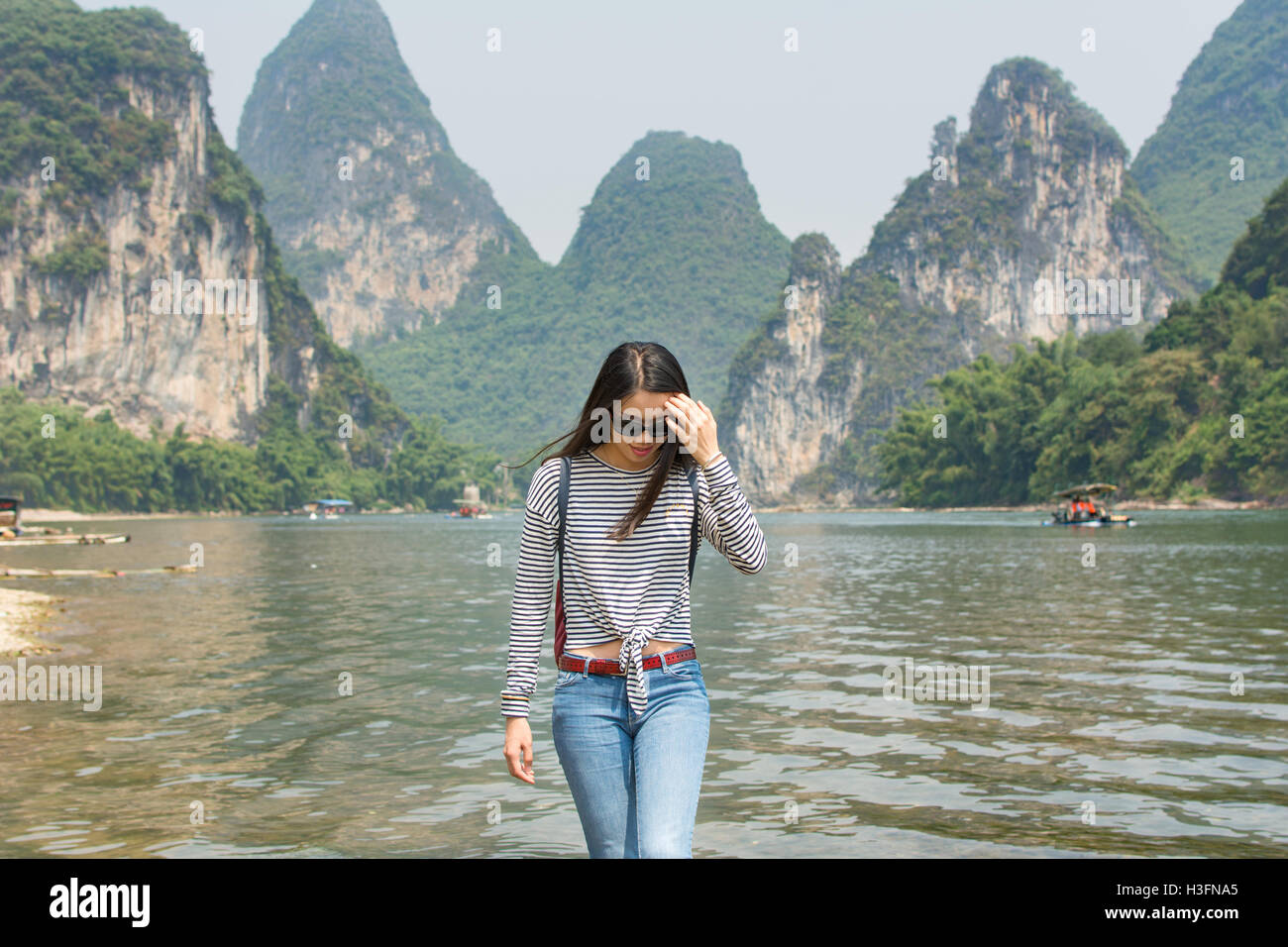 Beautiful tourist girl at Li River in Yangshou, China Stock Photo