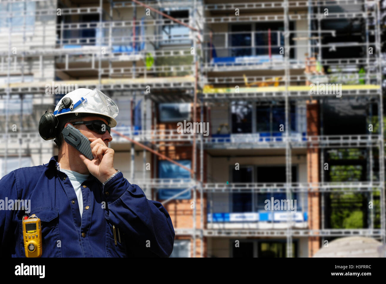 building worker and construction plant Stock Photo