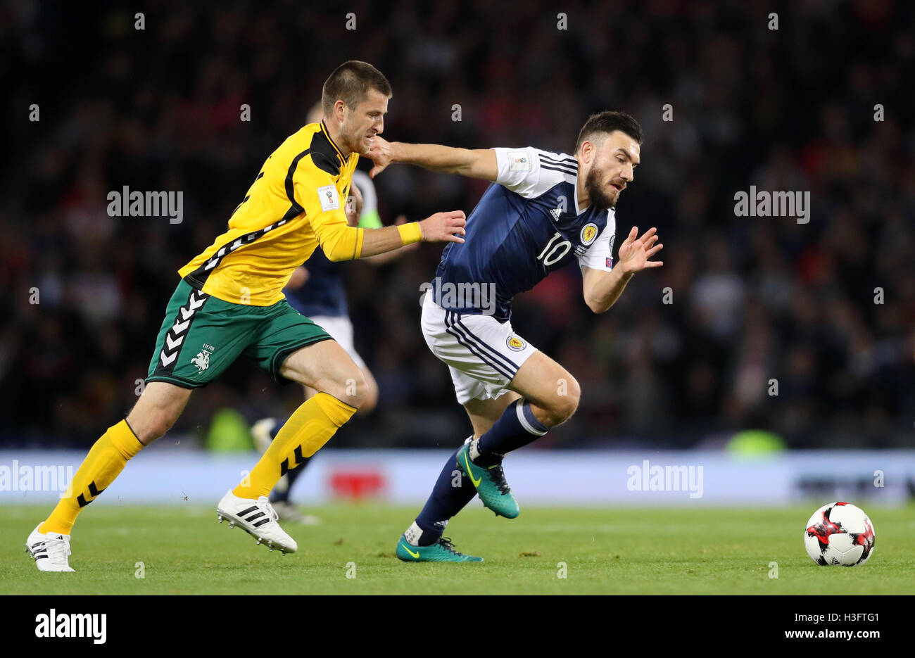 Lithuania's Mantas Kuklys and Scotland's Robert Snodgrass during the 2018 FIFA World Cup Qualifying match at Hampden Park, Glasgow. Stock Photo