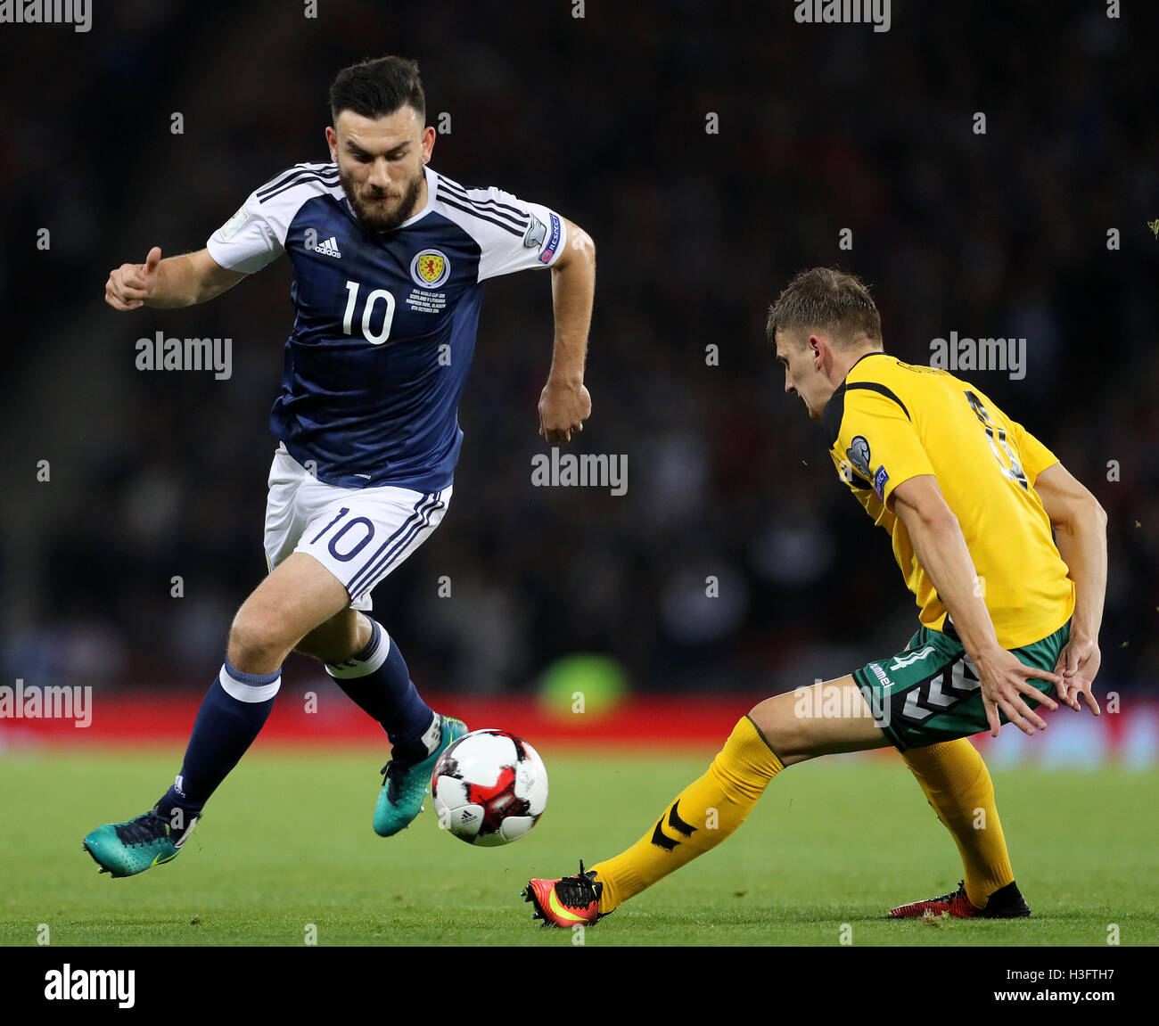 Scotland's Robert Snodgrass and Lithuania's Edvinas Girdvainis battle for the ball during the 2018 FIFA World Cup Qualifying match at Hampden Park, Glasgow. Stock Photo