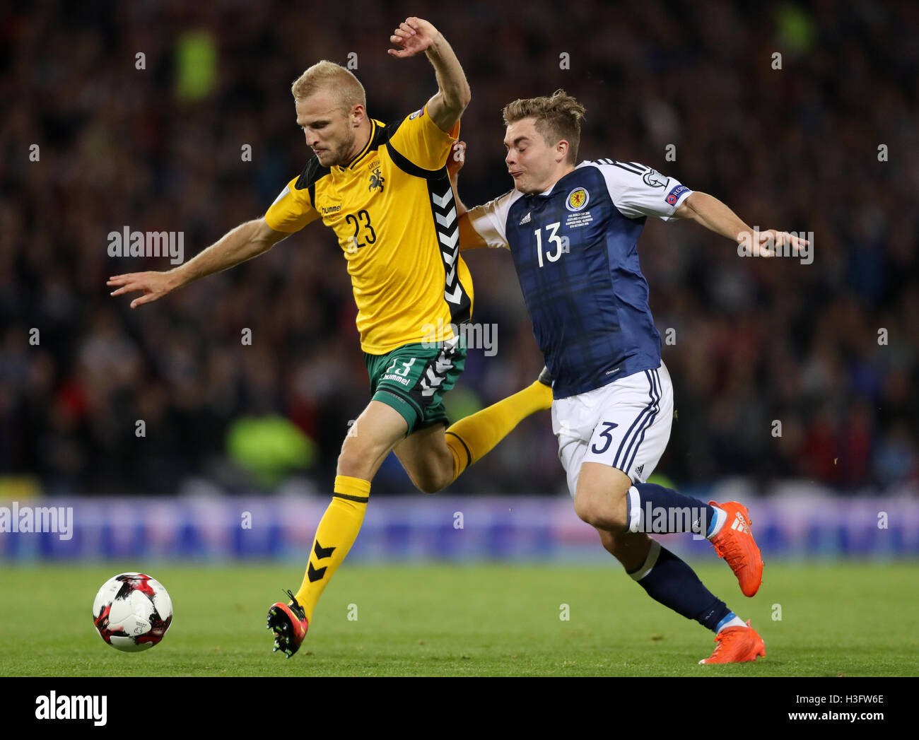 Lithuania's Vytautas Andriuskevicius and Scotland's James Forrest battle for the ball during the 2018 FIFA World Cup Qualifying match at Hampden Park, Glasgow. Stock Photo