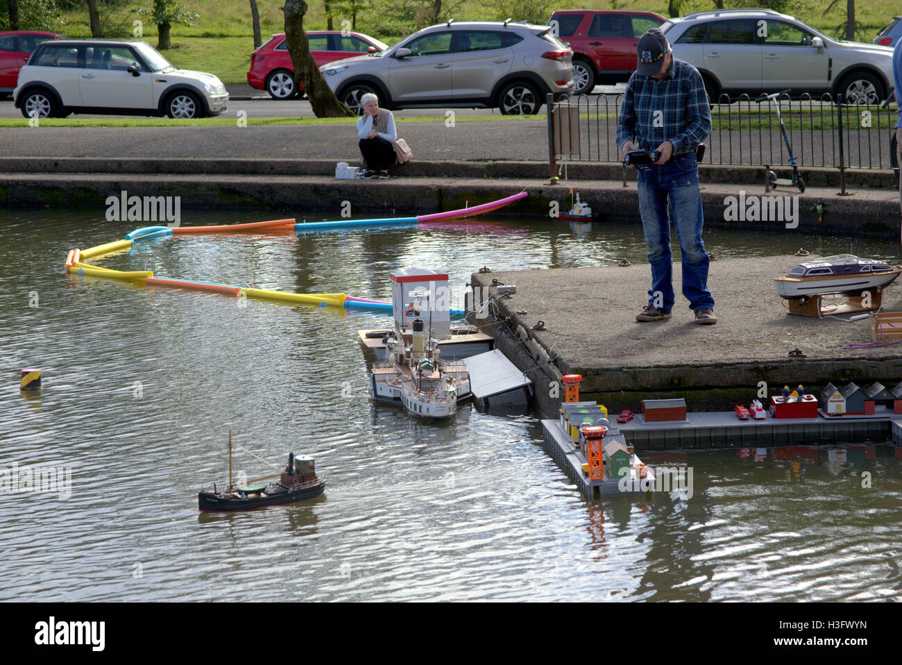 Model boat display including trawler  toy docks and sailboat during local celebrations at open day at Knightswood Park. Stock Photo