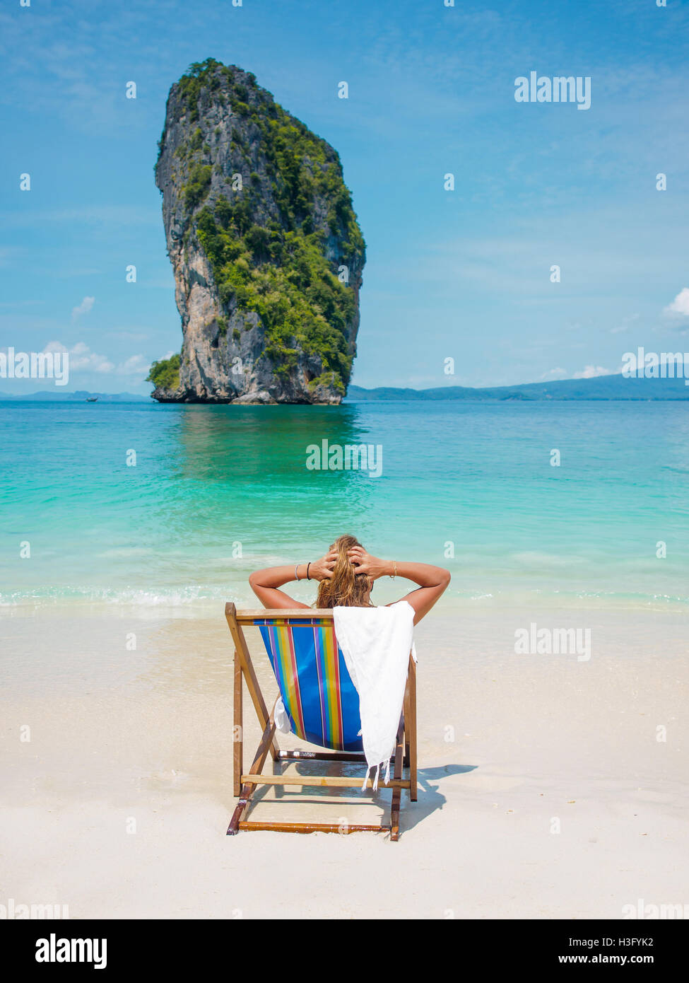 Beautiful woman on the beach in thailand winter holidays in the sun