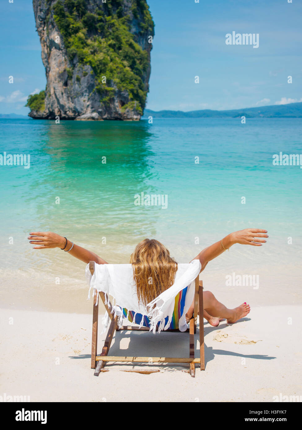Beautiful woman on the beach in thailand winter holidays in the sun