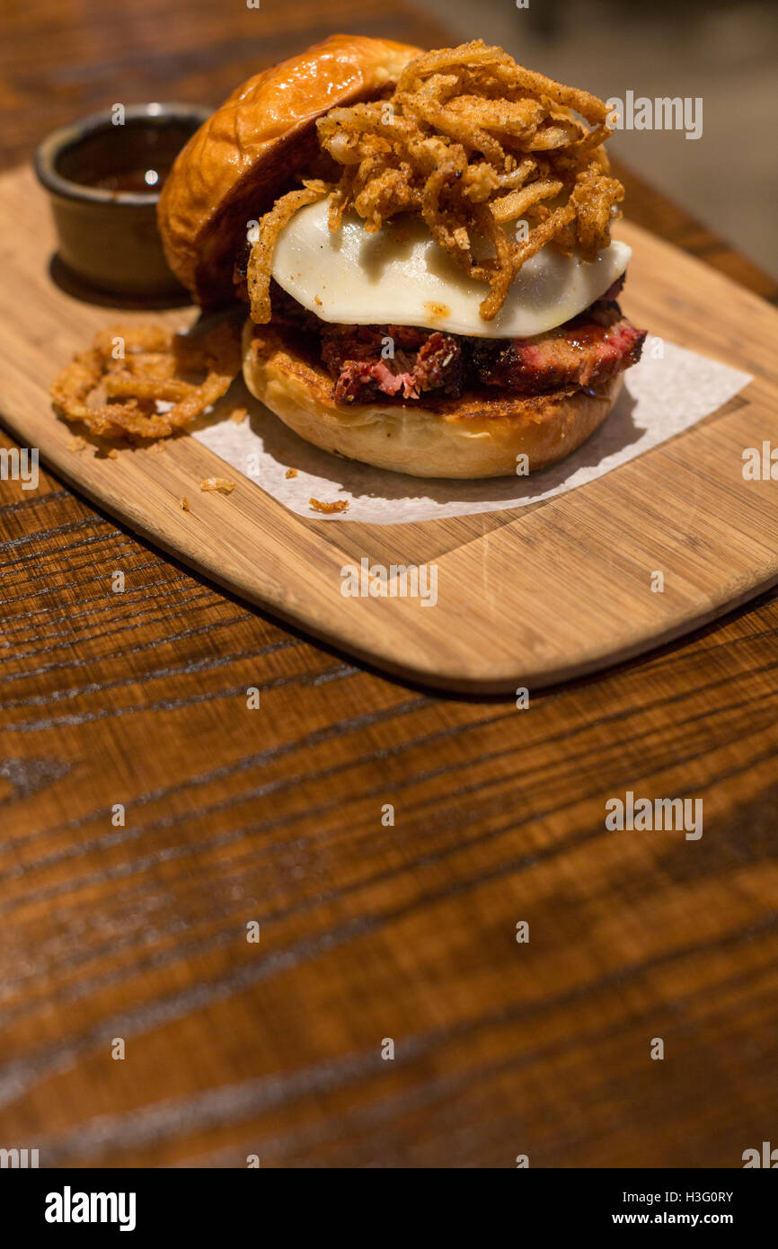 A beef brisket sandwich with fried onions and cheese Stock Photo Alamy