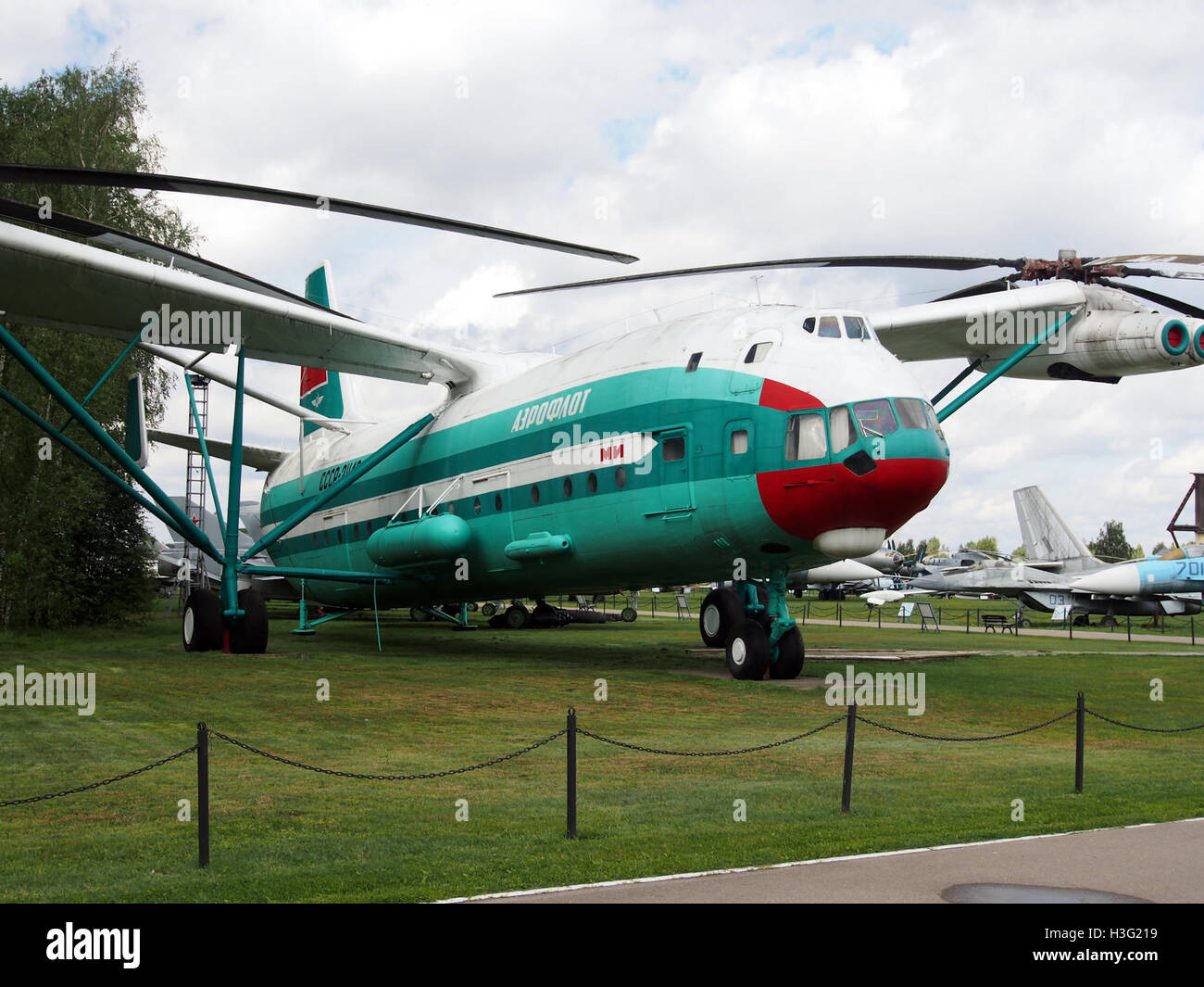 The Mil V-12 (CCCP-21142) is a Soviet-era heavy transport helicopter displayed at the Central Air Force Museum. It was one of the largest helicopters ever built, designed for cargo and troop transport. Stock Photo