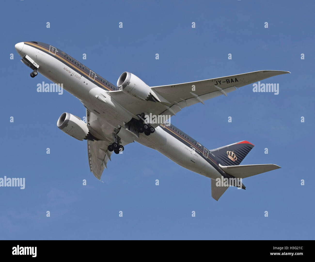 A Royal Jordanian Airlines Boeing 787-8, registered as JY-BAA, arrives at London Heathrow Airport on April 11, 2015. The aircraft, part of the airline’s modern fleet, is seen landing, reflecting the airline's international connectivity and service. Stock Photo