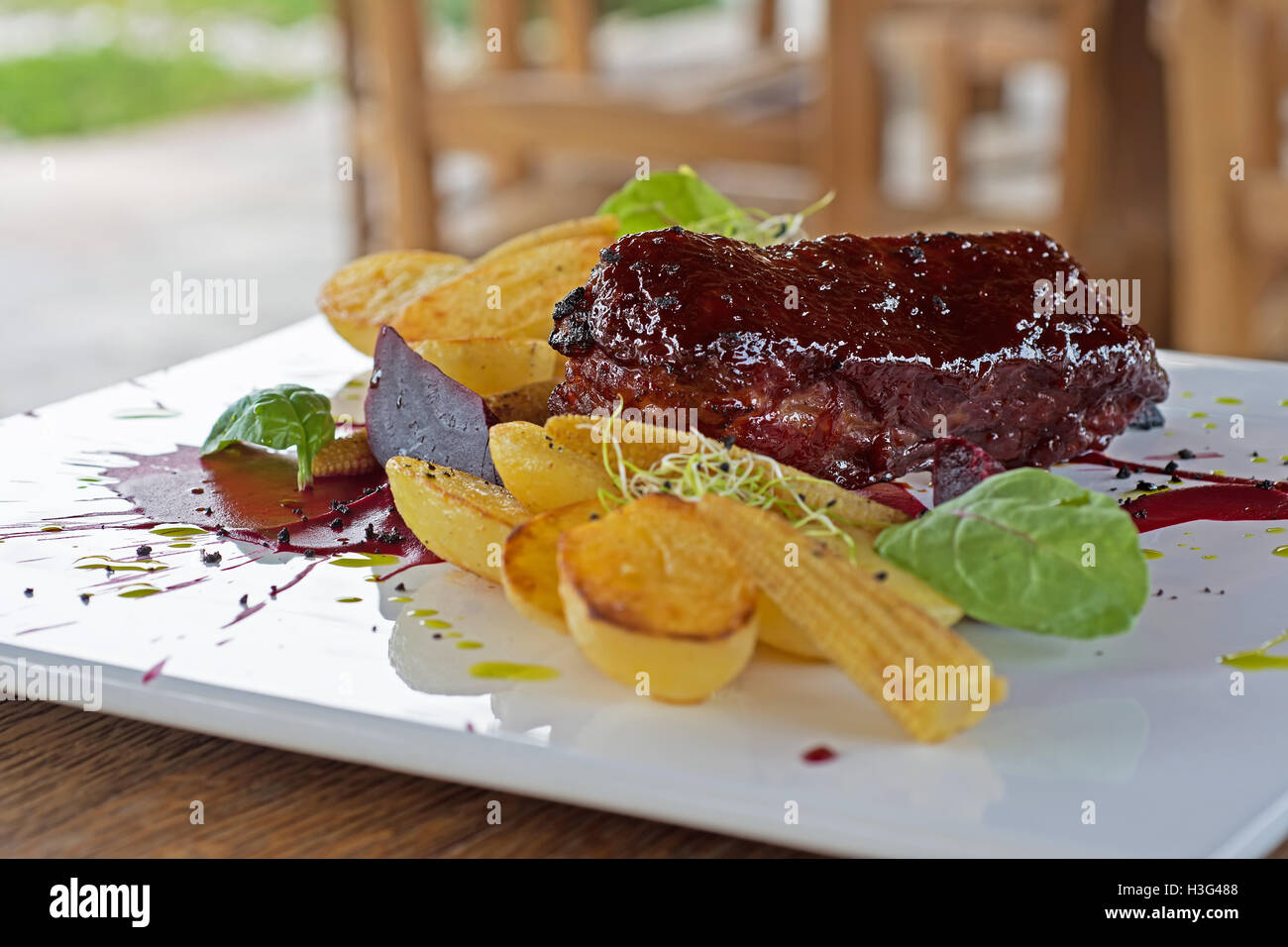 Pork Ribs Barbecue Roasted With Potatoes Stock Photo