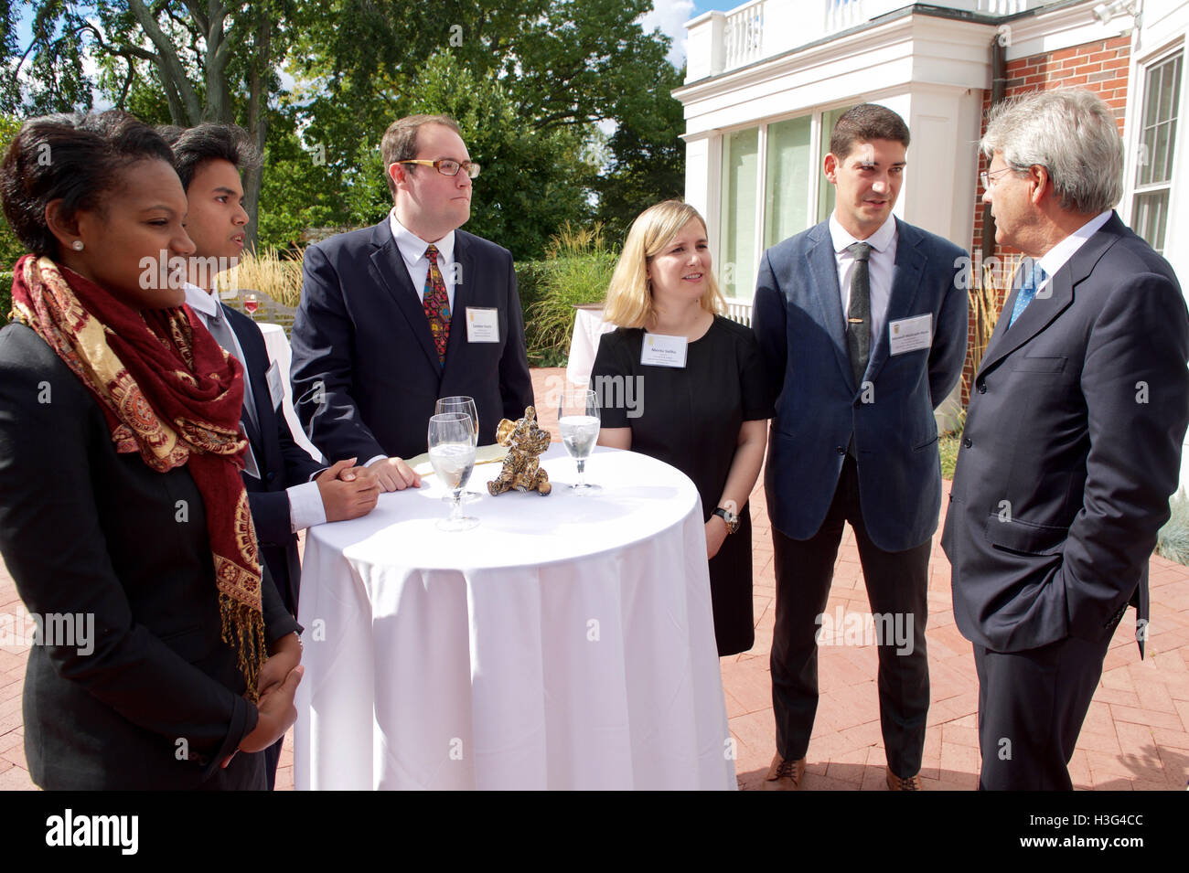 Italian Foreign Minister Paolo Gentiloni chats with students from the Fletcher School of Law and Diplomacy and Tisch College on September 24, 2016, at Gifford House on the campus of Tufts University in Medford, Mass., before a meeting with U.S. Secretary of State John Kerry and the Quintet ministers from the United Kingdom, France, Germany, Italy, and the European Union. [State Department photo/ ] Stock Photo