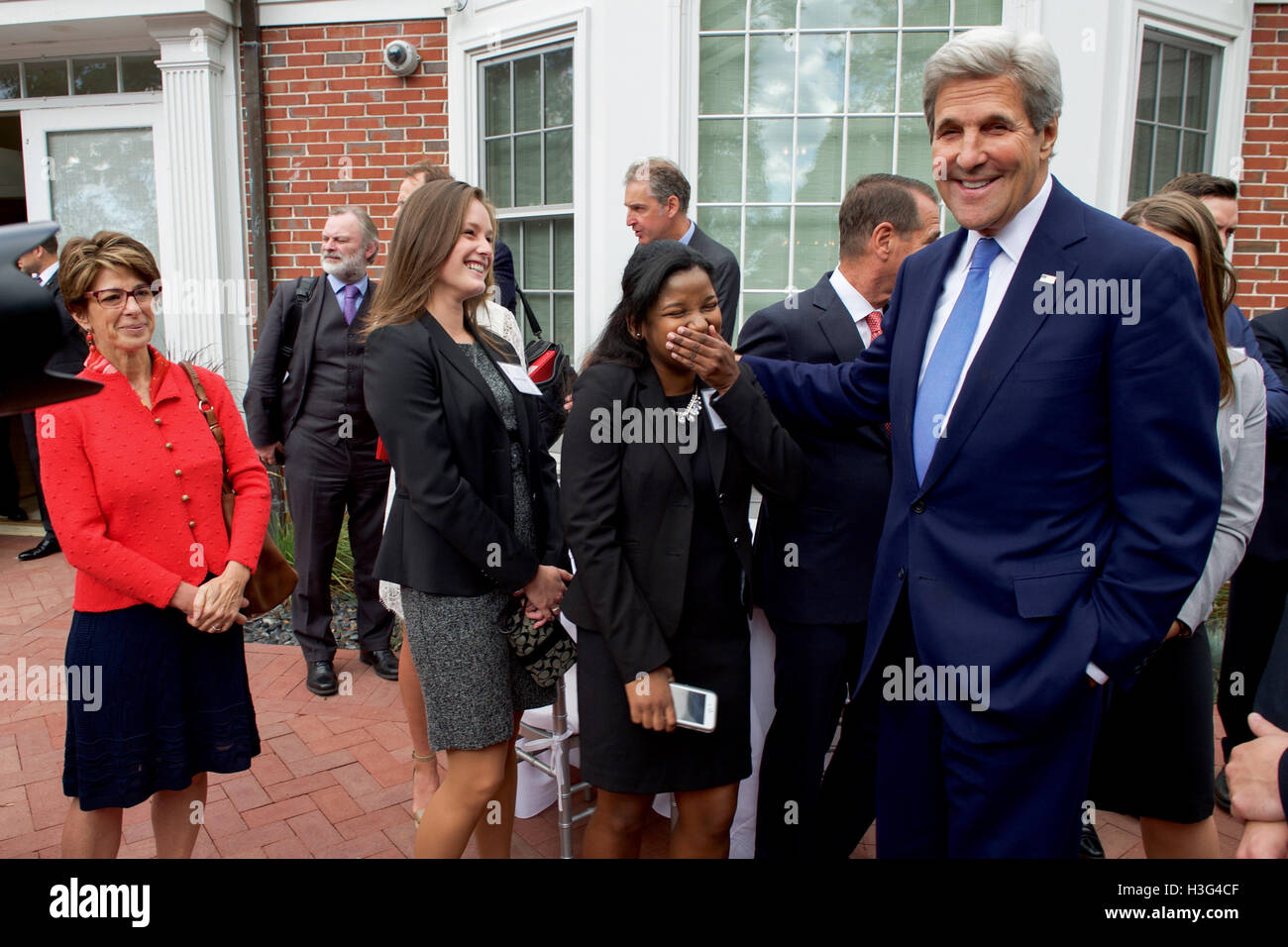 U.S. Secretary of State John Kerry shares a laugh with students from the Fletcher School of Law and Diplomacy and Tisch College on September 24, 2016, at Gifford House on the campus of Tufts University in Medford, Mass., before a meeting with the Quintet ministers from the United Kingdom, France, Germany, Italy, and the European Union. [State Department photo/ ] Stock Photo