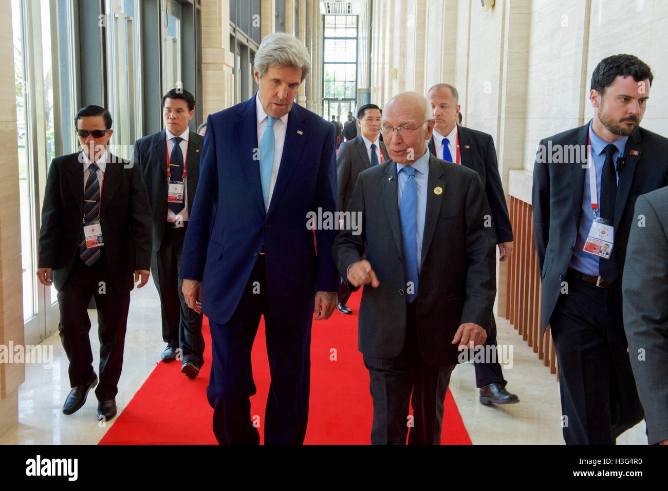 U.S. Secretary of State John Kerry walks with Pakistan Foreign Minister Sartaj Aziz at the National Convention Center in Vientiane, Laos, on July 26, 2016, before a meeting of the ASEAN Regional Forum amid the annual meeting of the Association of Southeast Asian Nations (ASEAN). Stock Photo