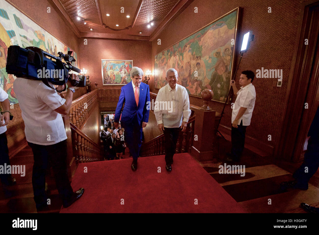 Philippines Foreign Secretary Perfecto Yasay guides U.S. Secretary of State John Kerry as they walk through the Malacañang Palace in Manila, Philippines, on July 27, 2016, before the Secretary held a working lunch with Philippines President Rodrigo Duterte. Stock Photo