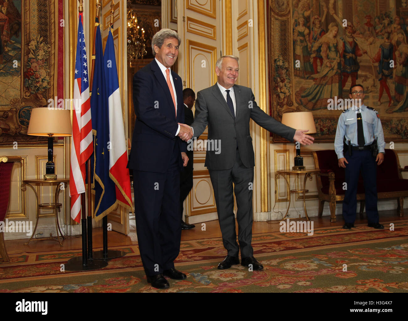 U.S. Secretary of State John Kerry shakes hands with French Foreign Minister Jean-Marc Ayrault at the French Ministry of Foreign Affairs in Paris, France on July 30, 2016. Stock Photo